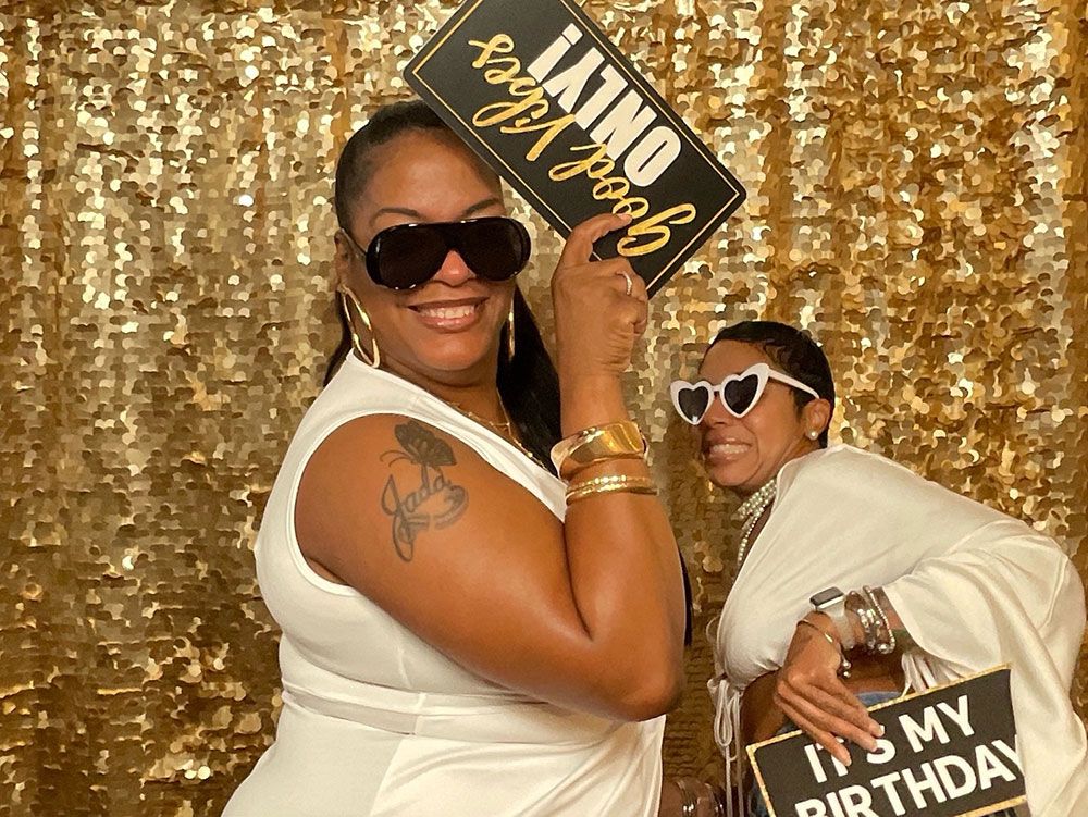Guest celebrating a 50th birthday at a VIMO Events photo booth